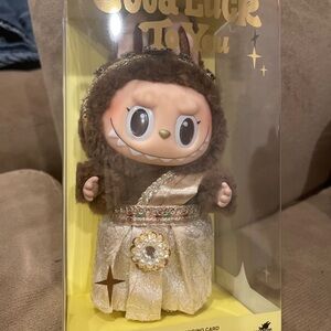 Brown and Gold Doll with Accessories